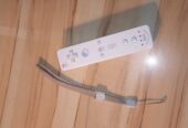 Manette Nintendo Wii blanche (originale) + bracelet